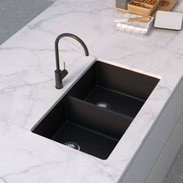Forio 813 black quartz double bowl sink undermounted in a white marble benchtop with a matching black mixer