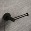 Lucito matte black toilet roll holder mounted on a grey stone-tiled bathroom wall