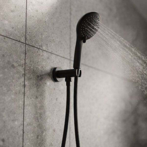 Coen 3 function shower on bracket in black installed on a tiled shower wall