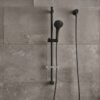 Coen 3 Function Shower On Rail Black Coen 3 function shower on rail in matte black installed on a tiled shower wall