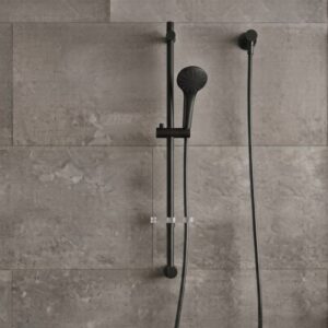 Coen 3 function shower on rail in matte black installed on a tiled shower wall