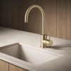 Lucito Gooseneck Sink Mixer Brushed Brass on Bench Top Brisbane
