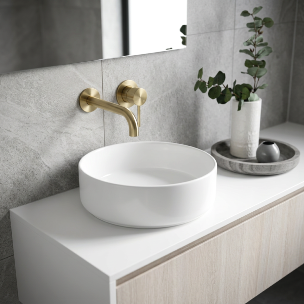 Lucito Wall Mixer and Spout Brushed Brass in Bathroom basin scene