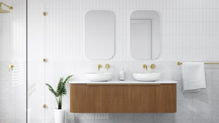 Modern Brisbane bathroom renovation with a fluted timber vanity, twin vessel basins and brushed brass tapware